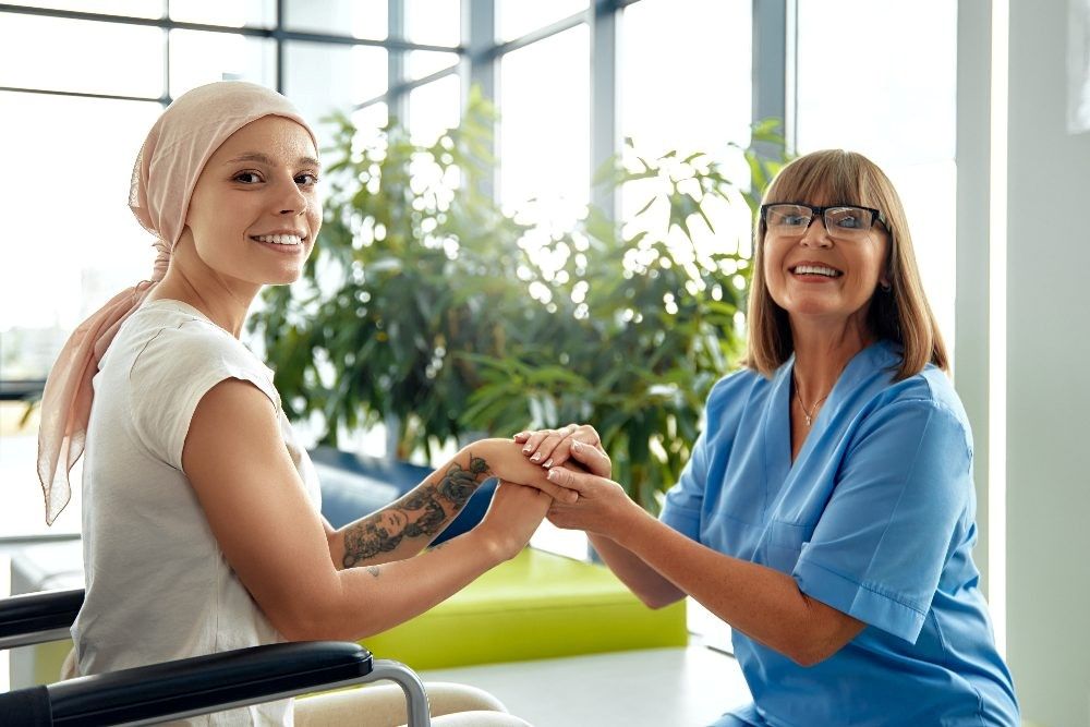 Patient Receiving Supportive Care During Treatment in Dallas & Mansfield, TX