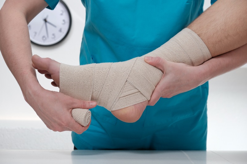 Early wound treatment with a bandaged foot at a clinic in Dallas and Mansfield, TX